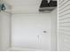 Utility space includes white wire shelving for storage, neutral paint, and utility hook-ups at 4141 Dolphin Dr # 4141, Tampa, FL 33617