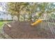Community playground featuring a slide, climbing dome, and swings for outdoor fun at 4141 Dolphin Dr # 4141, Tampa, FL 33617