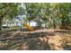 Gathering-friendly playground featuring a slide and swings, nestled in a wooded setting at 4141 Dolphin Dr # 4141, Tampa, FL 33617