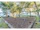 Neighborhood playground with slide and swings surrounded by mature trees at 4141 Dolphin Dr # 4141, Tampa, FL 33617