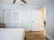 Bright bedroom with hardwood floors, ceiling fan, and closet at 4231 8Th N St, St Petersburg, FL 33703