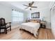 Inviting bedroom featuring a ceiling fan, art and light-filled window at 4231 8Th N St, St Petersburg, FL 33703