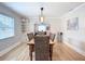 Elegant dining room showcasing hardwood floors, stylish seating, and seamless flow into living area at 4231 8Th N St, St Petersburg, FL 33703