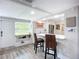 Kitchen with a breakfast bar, stainless steel appliances, and eat-in dining area at 4231 8Th N St, St Petersburg, FL 33703