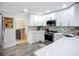Modern kitchen with white cabinets, stainless steel appliances, and attractive backsplash tiles at 4231 8Th N St, St Petersburg, FL 33703