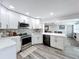 Well-lit kitchen featuring stainless appliances, a dishwasher, and decorative backsplash at 4231 8Th N St, St Petersburg, FL 33703