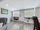 Living room with comfortable seating and a view of the kitchen and entryway at 4231 8Th N St, St Petersburg, FL 33703