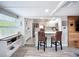 Open living space with kitchen view, bar seating, and rustic wood accents at 4231 8Th N St, St Petersburg, FL 33703