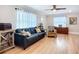 Bright living room boasting hardwood floors, classic furnishings, and natural light from large windows at 4231 8Th N St, St Petersburg, FL 33703