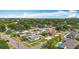 Charming neighborhood street view showcasing homes with well-manicured lawns and a refreshing pool in the foreground at 4231 8Th N St, St Petersburg, FL 33703