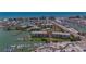 Waterfront condos featuring docks, lush landscaping, and stunning views of the bay and city at 425 150Th Ave # 2301, Madeira Beach, FL 33708
