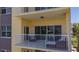 Relaxing balcony with outdoor seating offering views of the water and lush greenery at 425 150Th Ave # 2301, Madeira Beach, FL 33708