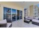 Wide balcony with outdoor seating offering unobstructed marina and palm tree views at 425 150Th Ave # 2301, Madeira Beach, FL 33708