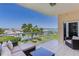 Relaxing balcony features cozy seating and overlooks scenic harbor views at 425 150Th Ave # 2301, Madeira Beach, FL 33708