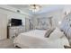 Bright bedroom featuring a decorative ceiling fan, sitting area and large windows with nice views at 425 150Th Ave # 2301, Madeira Beach, FL 33708