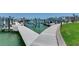 Wide view of a community boat dock showcasing multiple slips, boatlifts, and easy water access at 425 150Th Ave # 2301, Madeira Beach, FL 33708