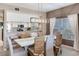 Dining area showcasing an open floor plan with a kitchen view and natural lighting at 425 150Th Ave # 2301, Madeira Beach, FL 33708
