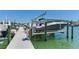 Dock view showing a well-equipped boat lift and easy access to deep water boating at 425 150Th Ave # 2301, Madeira Beach, FL 33708