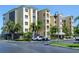 Beautiful condo exterior with lush tropical landscaping and ample parking at 425 150Th Ave # 2301, Madeira Beach, FL 33708