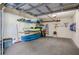 Organized garage features ample storage racks, gear, kayaks, and space for hobbies and recreation at 425 150Th Ave # 2301, Madeira Beach, FL 33708