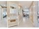 Inviting foyer with decorative console table, tile flooring, and open view to living spaces at 425 150Th Ave # 2301, Madeira Beach, FL 33708