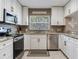 Well-appointed kitchen with stainless appliances, granite counters, and ample cabinet space at 425 150Th Ave # 2301, Madeira Beach, FL 33708