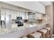 Stylish kitchen with stainless steel appliances, granite countertops, and bar seating at 425 150Th Ave # 2301, Madeira Beach, FL 33708