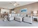 Inviting living room with comfortable seating offers open access to the kitchen and dining area at 425 150Th Ave # 2301, Madeira Beach, FL 33708