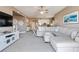 Comfortable living room with a plush sectional sofa, neutral tones and stylish decor at 425 150Th Ave # 2301, Madeira Beach, FL 33708
