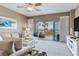 Relaxing living room with a large balcony providing stunning views of palm trees and waterways at 425 150Th Ave # 2301, Madeira Beach, FL 33708
