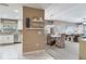 Open-concept living space showcases stylish furnishings, dining area, and a glimpse of the modern kitchen at 425 150Th Ave # 2301, Madeira Beach, FL 33708