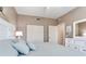 Bright main bedroom featuring a large bed, white furniture and beige walls, creating a peaceful retreat at 425 150Th Ave # 2301, Madeira Beach, FL 33708