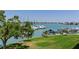 Scenic water view with docks, boats, and well-manicured lawn. A great spot for relaxation and recreation at 425 150Th Ave # 2301, Madeira Beach, FL 33708