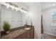 Bathroom featuring granite countertops, undermount sink, and decor at 4419 Ortona Ln, Wesley Chapel, FL 33543