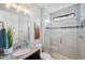 Modern bathroom featuring a glass-enclosed shower, granite countertop vanity, and stylish fixtures at 4419 Ortona Ln, Wesley Chapel, FL 33543