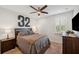Bedroom features a ceiling fan, plantation shutters, and carpet at 4419 Ortona Ln, Wesley Chapel, FL 33543