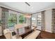 Elegant dining room with natural light and views of the pool at 4419 Ortona Ln, Wesley Chapel, FL 33543