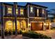 Charming two-story home showcasing a welcoming front door and manicured landscaping, highlighting curb appeal at 4419 Ortona Ln, Wesley Chapel, FL 33543