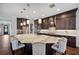 Spacious kitchen island with countertop seating and pendant lighting at 4419 Ortona Ln, Wesley Chapel, FL 33543