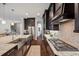 Modern kitchen showcasing a stainless steel sink and range with granite countertops at 4419 Ortona Ln, Wesley Chapel, FL 33543