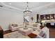 Open living area with views of the kitchen and staircase at 4419 Ortona Ln, Wesley Chapel, FL 33543