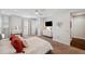 Spacious main bedroom with ensuite bath, vanity, and neutral decor at 4419 Ortona Ln, Wesley Chapel, FL 33543