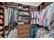 Walk-in closet features custom built-in shelving and storage at 4419 Ortona Ln, Wesley Chapel, FL 33543
