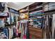 Walk-in closet features custom shelves and storage at 4419 Ortona Ln, Wesley Chapel, FL 33543