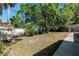 Large backyard featuring ample space and mature trees providing plenty of shade at 4425 W Bay Villa Ave, Tampa, FL 33611