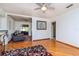 Inviting living room with hardwood floors, neutral walls, and an open doorway to another room at 4425 W Bay Villa Ave, Tampa, FL 33611