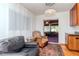 Cozy seating area featuring comfortable armchairs, hardwood floors, and a glimpse into the adjacent living space at 4425 W Bay Villa Ave, Tampa, FL 33611