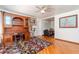 Hardwood flooring, ceiling fan, and a beautiful rug highlight this living space at 4425 W Bay Villa Ave, Tampa, FL 33611