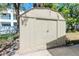 Exterior view of a tidy storage shed with double doors at 4425 W Bay Villa Ave, Tampa, FL 33611