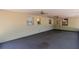 Spacious screened in lanai with ceiling fans offers views of the backyard at 4425 W Bay Villa Ave, Tampa, FL 33611